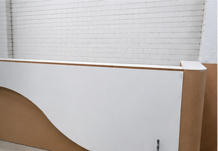 Curved reception counter under construction in the workshop
