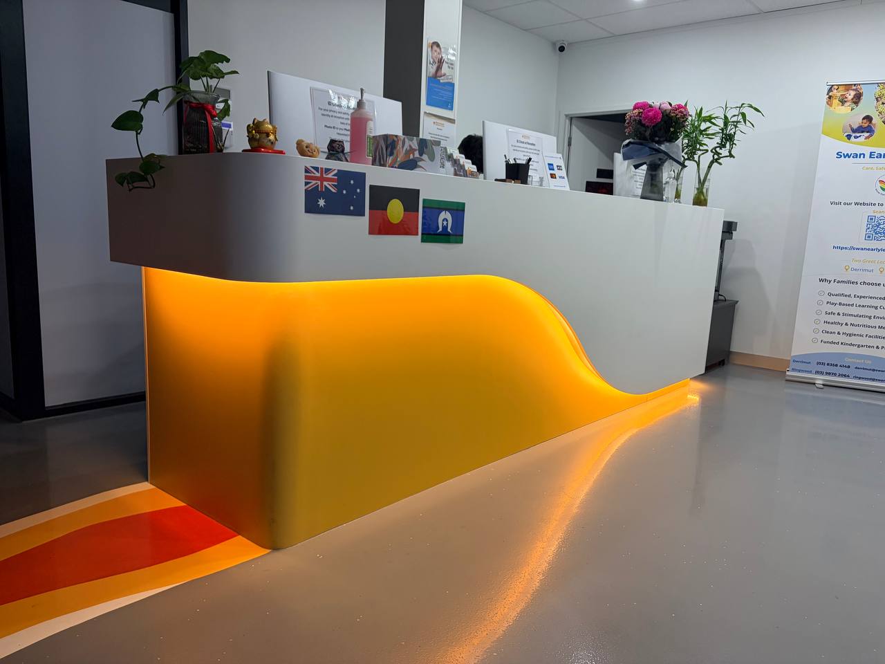 Completed bespoke curved reception counter with integrated lighting