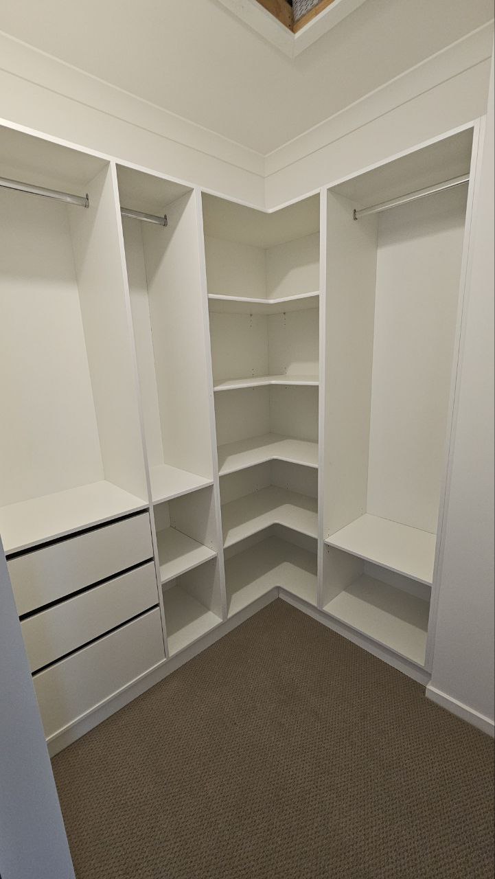 Custom walk-in robe interior with fitted storage
