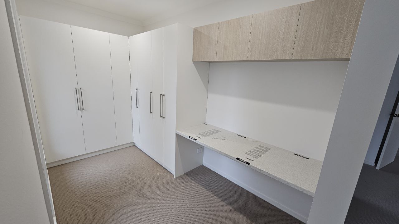 Completed fitted wardrobe and built-in workspace joinery